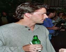 Andrew Shue consuming alcohol